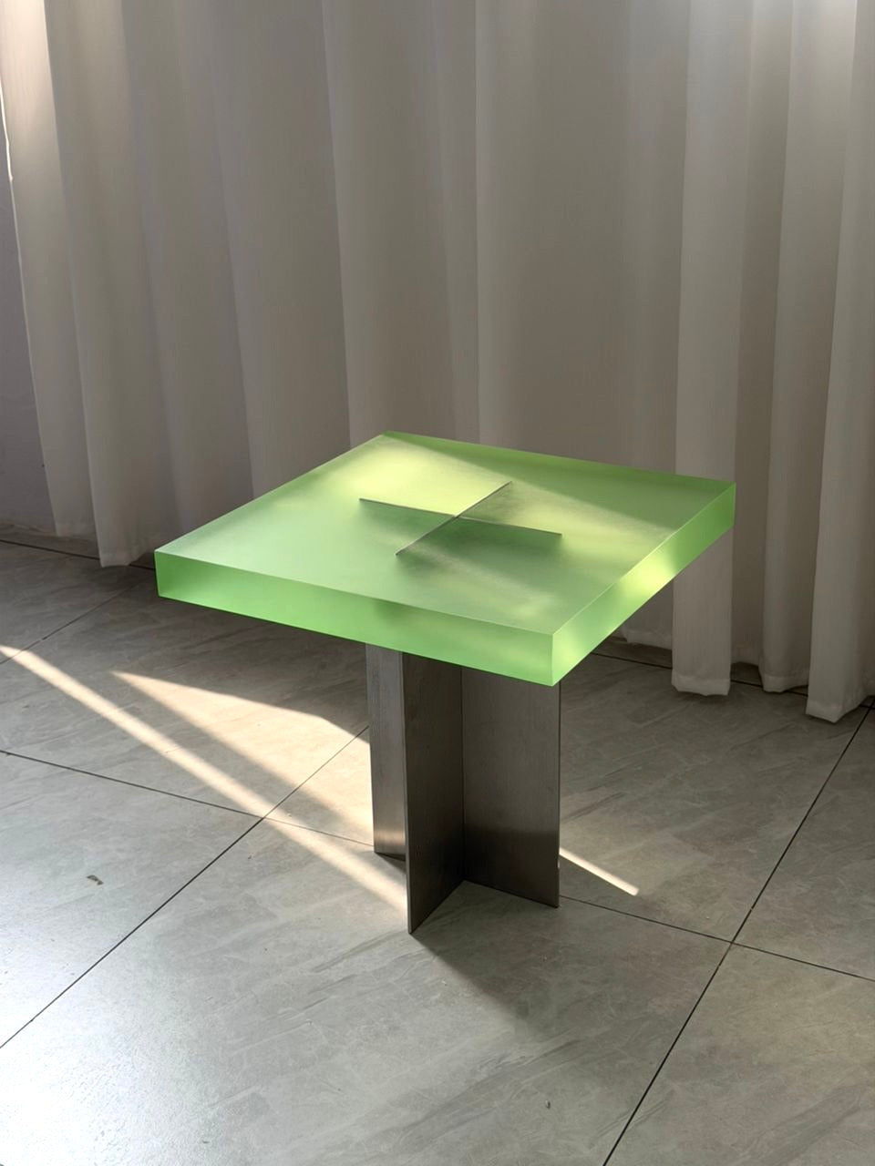 FROSTED SIDE TABLE by Luis West — a block of frosted green acrylic on a slim metal base