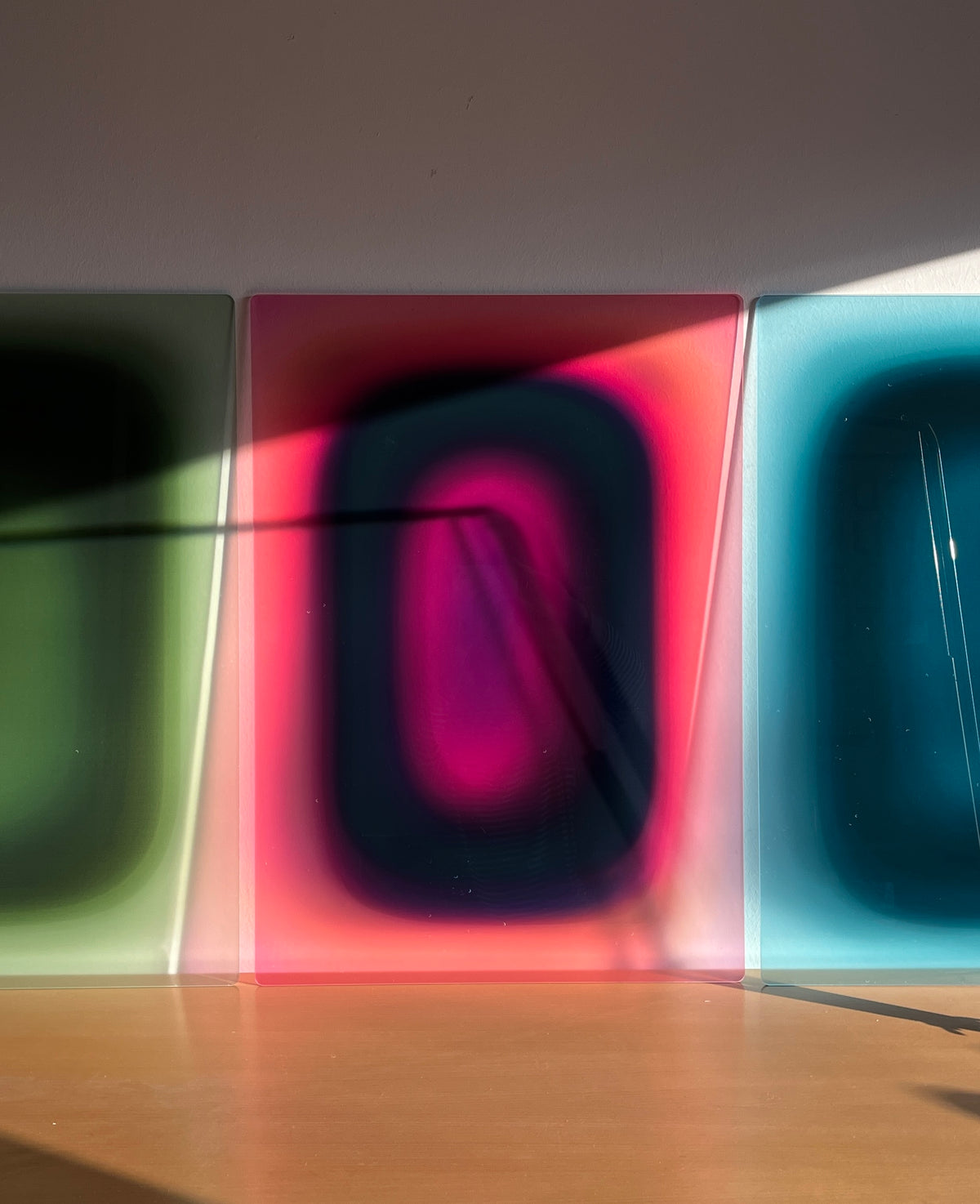 PURPLE APRICOT PILL by Luis West in a room washed in coloured light
